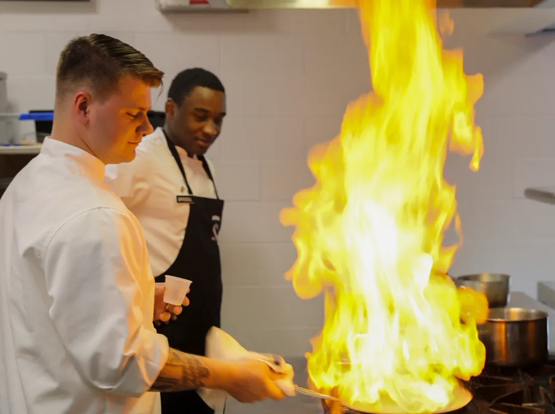 Cooking over the open fire in the dining room